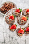 chocolate shortcrust pastry with nutella ganache, chocolate crumble, white chocolate shavings, fresh strawberries and edible gold leaf made fresh by Tartlet bakery