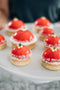 strawbelicious tart made with red chocolate glaze, white chocolate pearls and lemon thyme made fresh by tartlet bakery