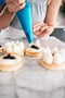 tartlet bakery made fresh blueberry tart vanilla cream cheese filling with chantilly cream dried edible rose petals and pistachios