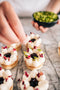tartlet bakery made fresh blueberry tart vanilla cream cheese filling with chantilly cream dried edible rose petals and pistachios