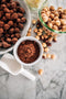 premium quality ingredients cocoa powder with dusted hazelnuts and freshly roasted hazelnuts made fresh by tartlet bakery