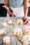 Italian passionfruit meringue tart torched flamed creating a baked look made fresh by tartlet bakery