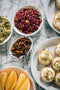 crushed pistachios, edible rose petals, star anise, fresh orange and white chocolate tarts made fresh by tartlet bakery